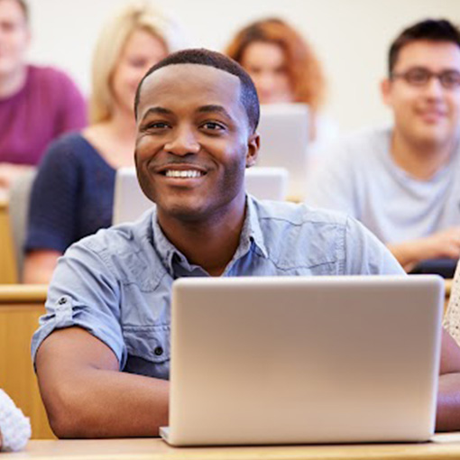 hatian student at computer in esol class